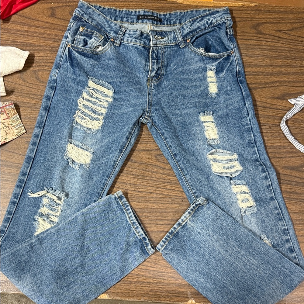 Distressed Blue Denim Jeans